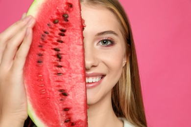 Beautiful girl with slice of watermelon on crimson background, closeup