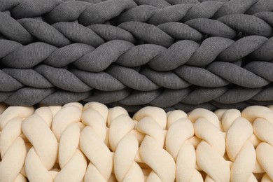Chunky knit blankets as background, closeup view