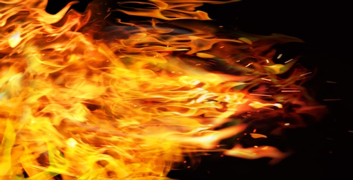 Beautiful bright fire flames on black background. Banner design