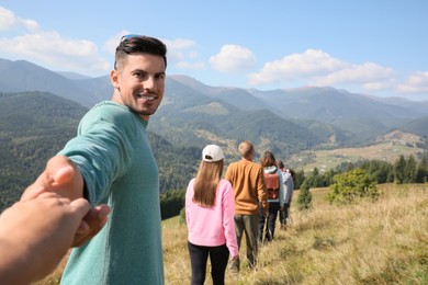 Photo of Group of people spending time together in mountains