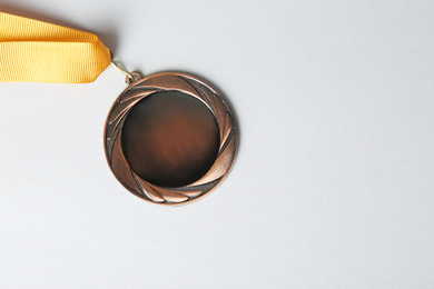 Bronze medal on white background, top view. Space for design