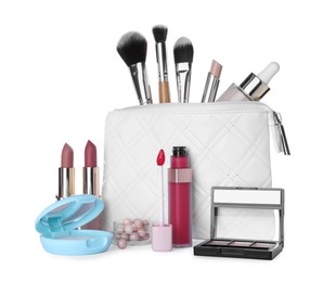 Different luxury decorative cosmetics, brushes and case on white background