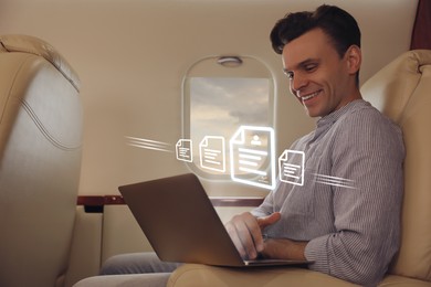 Concept of electronic signature. Man using laptop in airplane during flight