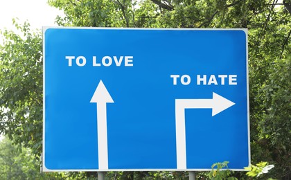 Road sign with different directions - TO HATE or TO LOVE outdoors