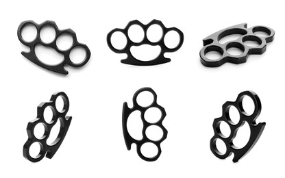 Set with metal black brass knuckles on white background 