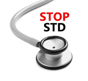 Image of Text STOP STD and stethoscope on white background, closeup