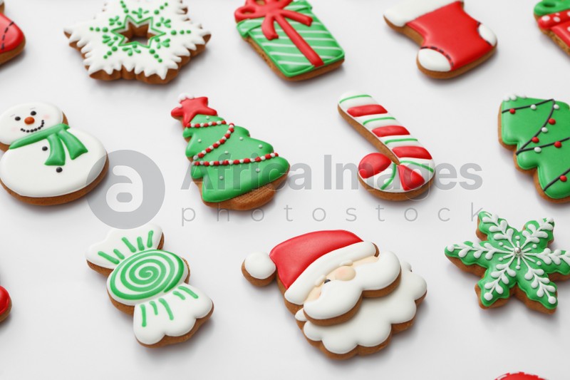 Different Christmas gingerbread cookies on white background, closeup