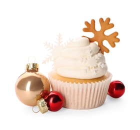 Tasty Christmas cupcake with snowflakes and baubles on white background