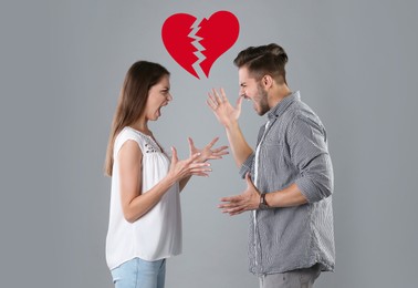 Young couple having argument and illustration of broken heart on grey background. Relationship problems