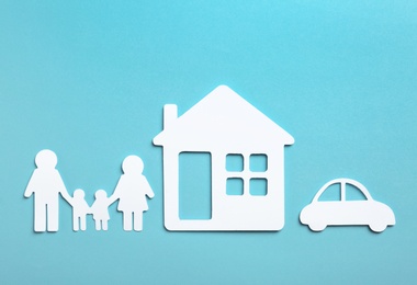 Paper silhouettes of family, house and car on color background, flat lay. Life insurance concept