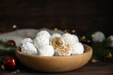 Tasty snowball cookies in wooden bowl. Christmas treat