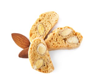 Photo of Slices of tasty cantucci and nuts on white background, top view. Traditional Italian almond biscuits