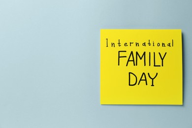 Card with words International Family Day on grey background, top view. Space for text
