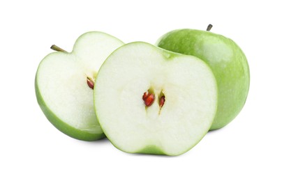 Whole and cut ripe apples on white background