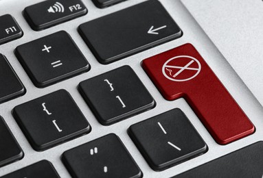 Red button with sign No smoking on computer keyboard, closeup