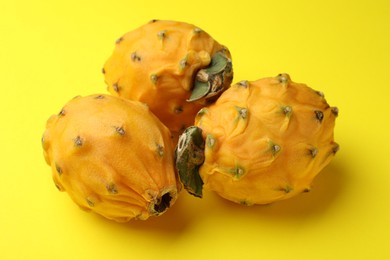 Delicious pitahaya fruits on yellow background, closeup