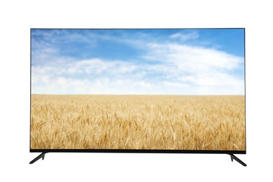 Image of Modern wide screen TV monitor showing picturesque view of wheat field and blue sky isolated on white