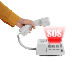Woman picking up telephone on white background. Emergency SOS call