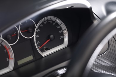 Speedometer and other indicators on car dashboard