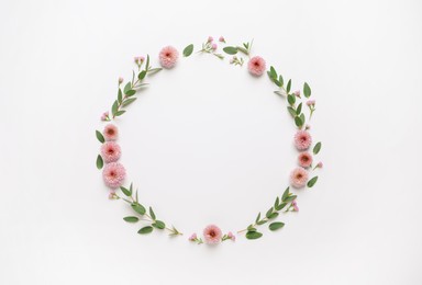 Beautiful wreath made of flowers and eucalyptus on white background, flat lay