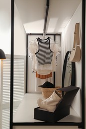 Dressing room interior with storage rack for shoes and accessories