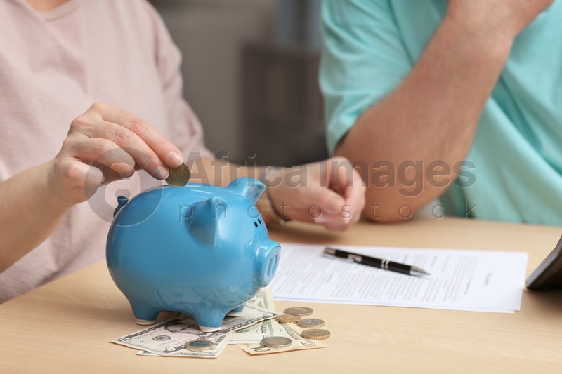 Mature couple thinking over pension payment at home, closeup