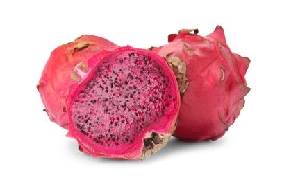 Photo of Delicious cut and whole red pitahaya fruits on white background