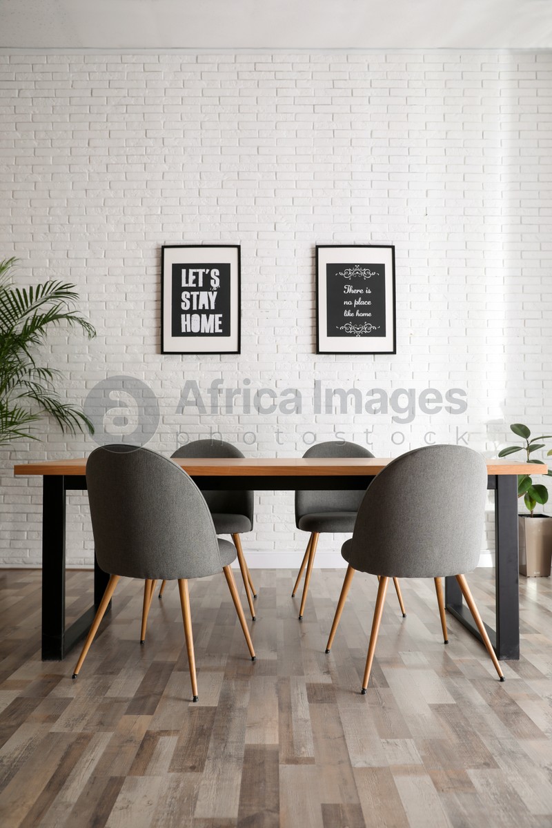 Photo of Modern dining room interior with stylish furniture