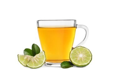 Glass cup of bergamot tea and fresh fruit on white background