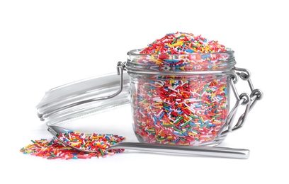 Colorful sprinkles and glass jar on white background. Confectionery decor