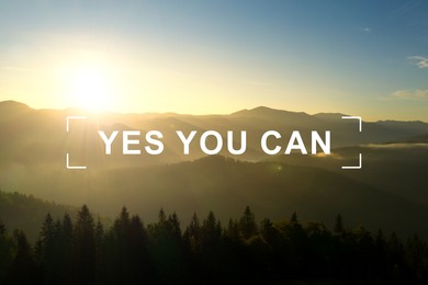 Yes You Can. Motivational quote inspiring to believe in yourself. Text against beautiful mountain landscape at sunrise