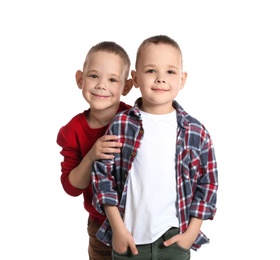 Portrait of cute twin brothers on white background