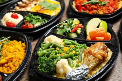 Lunchboxes with different meals on table. Healthy food delivery