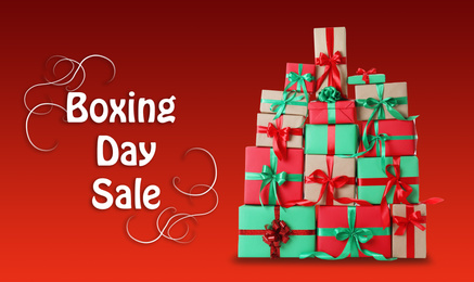 Boxing day sale. Many different gifts on red background