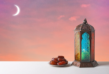 Image of Traditional Ramadan lantern and dates on table. Muslim holiday