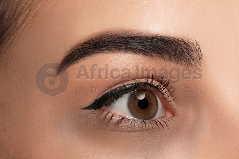 Tired young woman with dark circle under eye, closeup