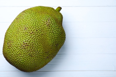 Delicious fresh exotic jackfruit on white table, top view. Space for text