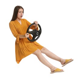 Emotional woman with steering wheel against white background