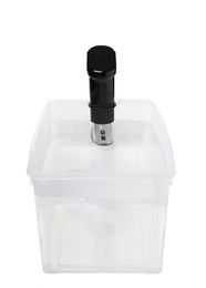 Thermal immersion circulator in plastic container with water isolated on white. Sous vide cooker