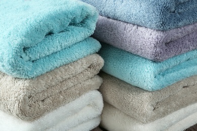 Pile of different soft terry towels, closeup