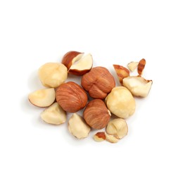 Heap of tasty hazelnuts on white background, top view