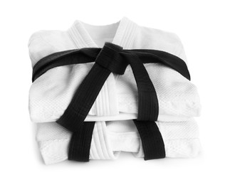 Photo of Martial arts uniform with black belts on white background