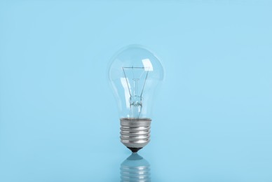 New modern light bulb on color background