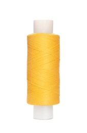 Spool of yellow sewing thread isolated on white