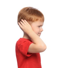 Little boy suffering from ear pain on white background