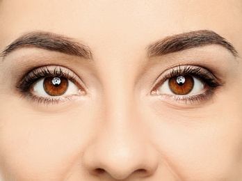 Young woman, closeup of eyes. Visiting ophthalmologist