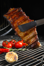 Delicious ribs and vegetables on barbecue grill