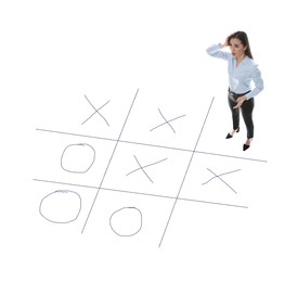 Young woman and illustration of tic-tac-toe game on white background, above view. Business strategy concept 