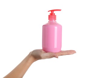 Woman holding liquid soap dispenser on white background, closeup