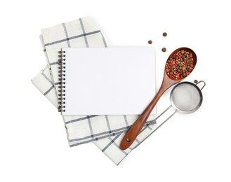 Blank recipe book, spices, napkin and kitchen utensils on white background, top view. Space for text